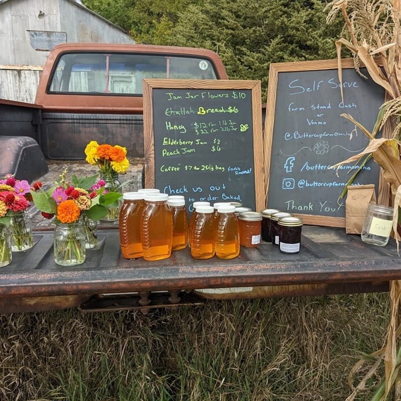Our farm stand set up in the bed of a pickup.